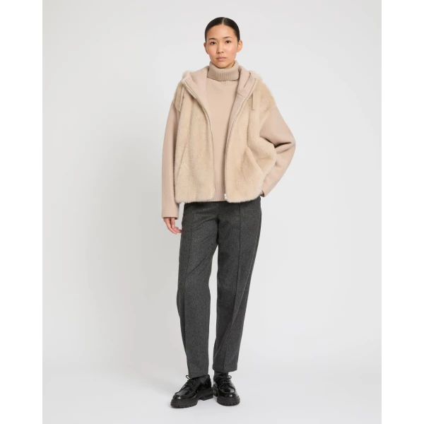 Woman wearing Yves Salomon shearling fur coat – luxury outerwear at Coveti