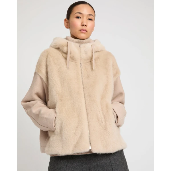 Woman wearing Yves Salomon shearling fur coat – luxury outerwear at Coveti