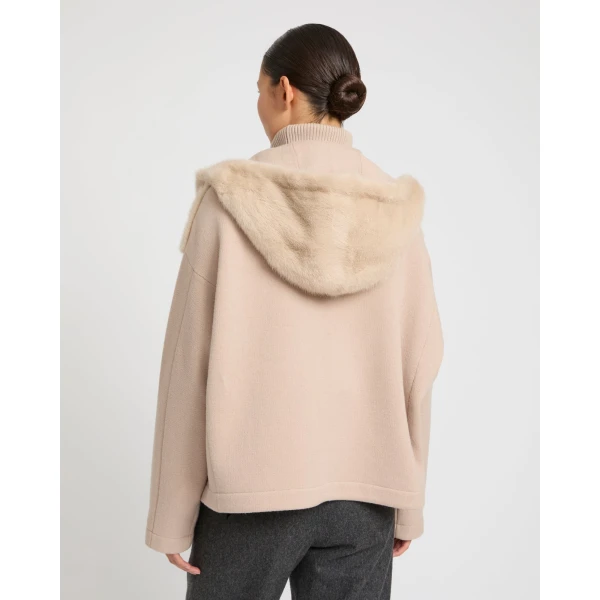Woman wearing Yves Salomon shearling fur coat – luxury outerwear at Coveti