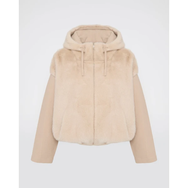 Woman wearing Yves Salomon shearling fur coat – luxury outerwear at Coveti