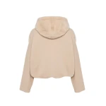 Woman wearing Yves Salomon shearling fur coat – luxury outerwear at Coveti