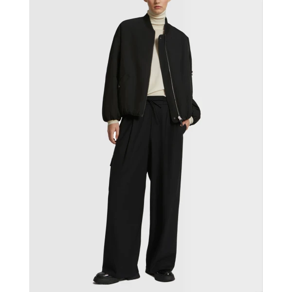 Woman wearing Yves Salomon shearling fur coat – luxury outerwear at Coveti
