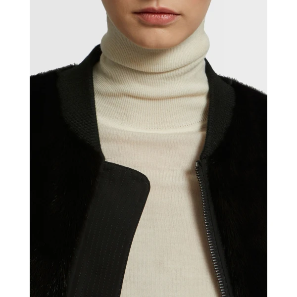 Woman wearing Yves Salomon shearling fur coat – luxury outerwear at Coveti