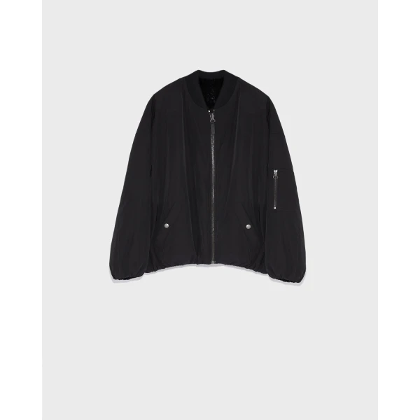 Woman wearing Yves Salomon shearling fur coat – luxury outerwear at Coveti