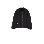 Woman wearing Yves Salomon shearling fur coat – luxury outerwear at Coveti