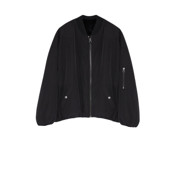 Woman wearing Yves Salomon shearling fur coat – luxury outerwear at Coveti