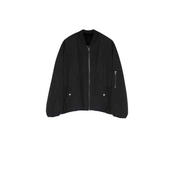 Woman wearing Yves Salomon shearling fur coat – luxury outerwear at Coveti