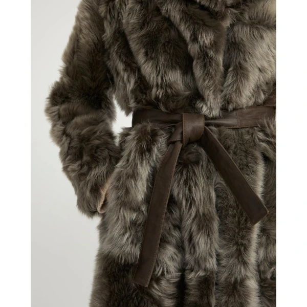 Woman wearing Yves Salomon shearling fur coat – luxury outerwear at Coveti