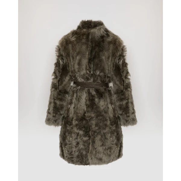 Woman wearing Yves Salomon shearling fur coat – luxury outerwear at Coveti