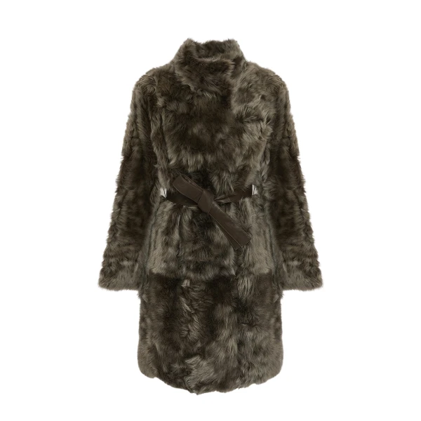 Woman wearing Yves Salomon shearling fur coat – luxury outerwear at Coveti