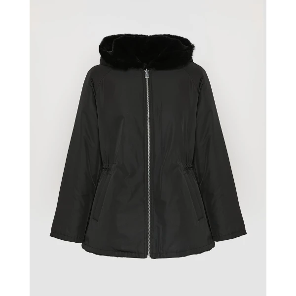 Woman wearing Yves Salomon shearling fur coat – luxury outerwear at Coveti