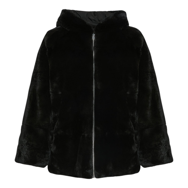 Woman wearing Yves Salomon shearling fur coat – luxury outerwear at Coveti