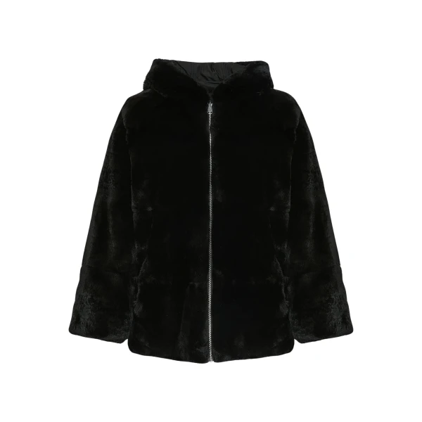 Woman wearing Yves Salomon shearling fur coat – luxury outerwear at Coveti