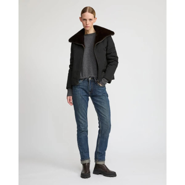 Woman wearing Yves Salomon shearling fur coat – luxury outerwear at Coveti