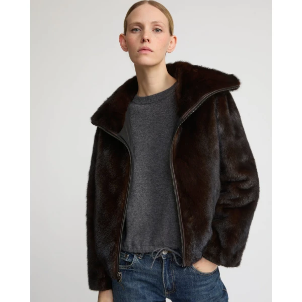 Woman wearing Yves Salomon shearling fur coat – luxury outerwear at Coveti