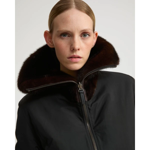 Woman wearing Yves Salomon shearling fur coat – luxury outerwear at Coveti