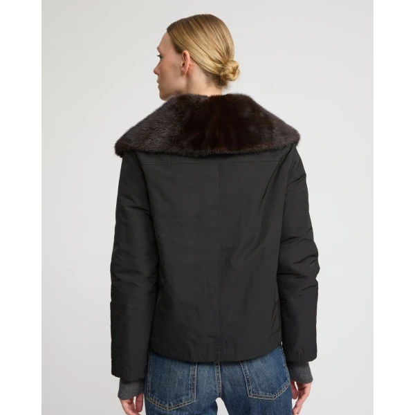 Woman wearing Yves Salomon shearling fur coat – luxury outerwear at Coveti