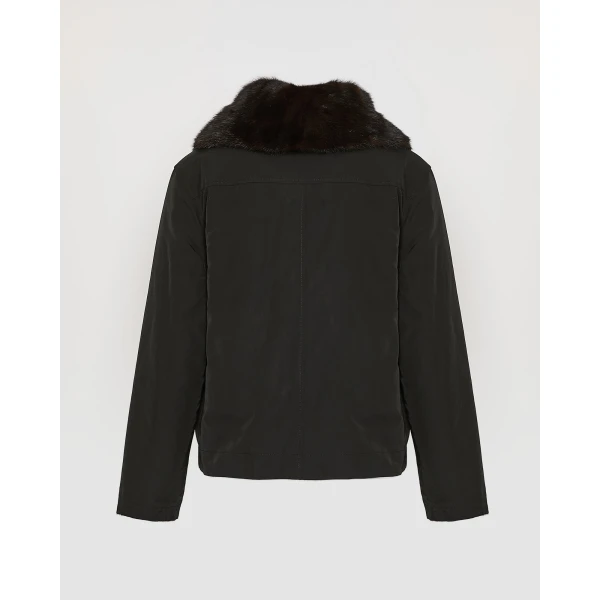 Woman wearing Yves Salomon shearling fur coat – luxury outerwear at Coveti