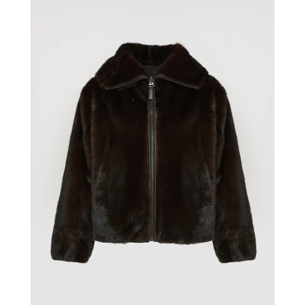 Woman wearing Yves Salomon shearling fur coat – luxury outerwear at Coveti
