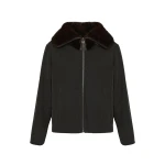 Woman wearing Yves Salomon shearling fur coat – luxury outerwear at Coveti