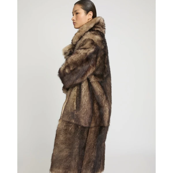 Woman wearing Yves Salomon shearling fur coat – luxury outerwear at Coveti
