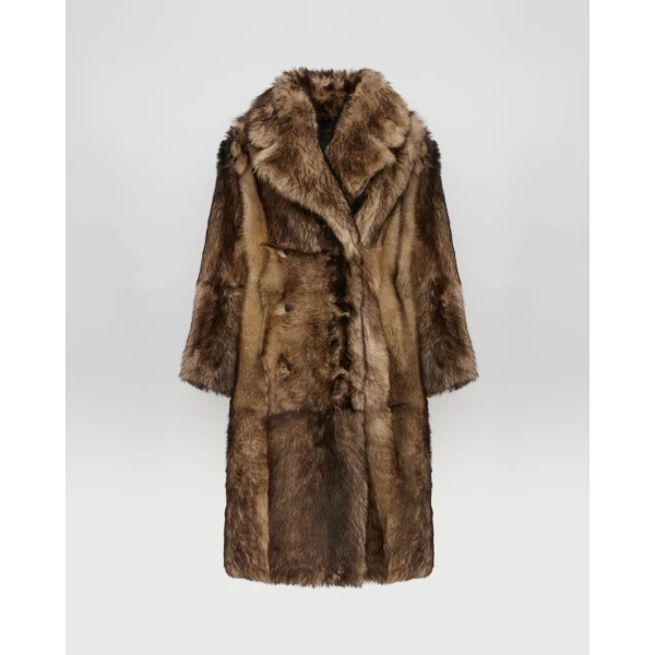 Woman wearing Yves Salomon shearling fur coat – luxury outerwear at Coveti