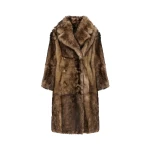 Woman wearing Yves Salomon shearling fur coat – luxury outerwear at Coveti