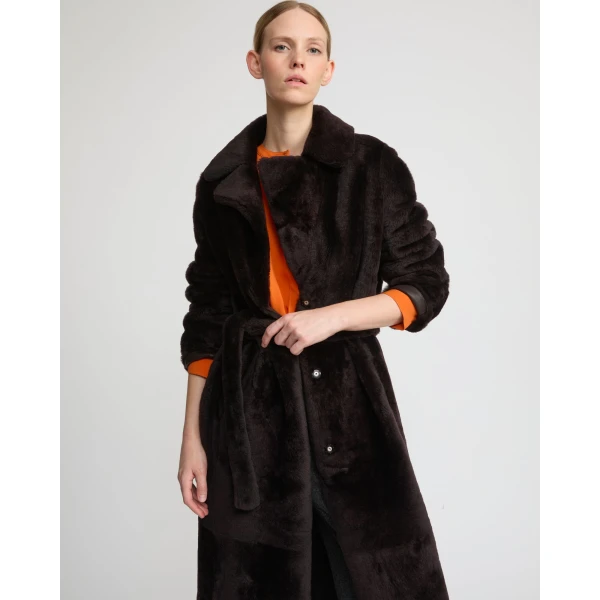 Woman wearing Yves Salomon shearling fur coat – luxury outerwear at Coveti