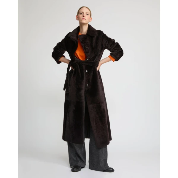 Woman wearing Yves Salomon shearling fur coat – luxury outerwear at Coveti