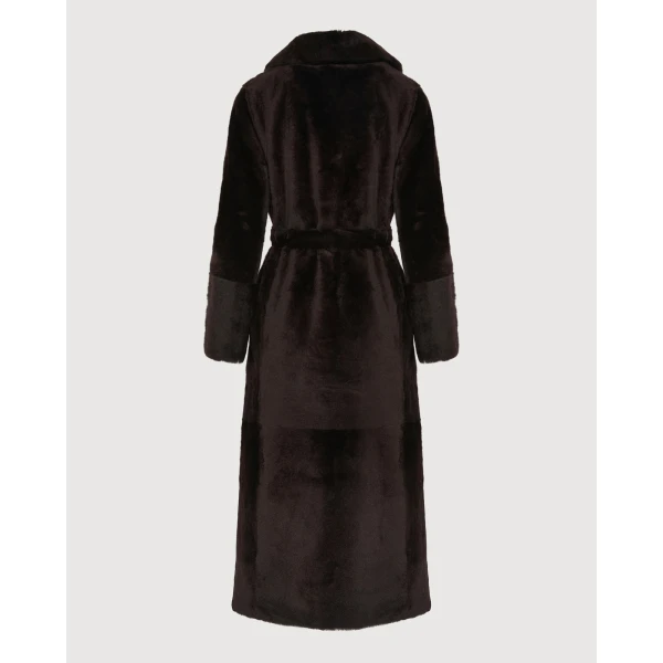 Woman wearing Yves Salomon shearling fur coat – luxury outerwear at Coveti