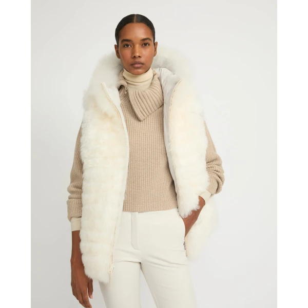 Woman wearing Yves Salomon shearling fur coat – luxury outerwear at Coveti