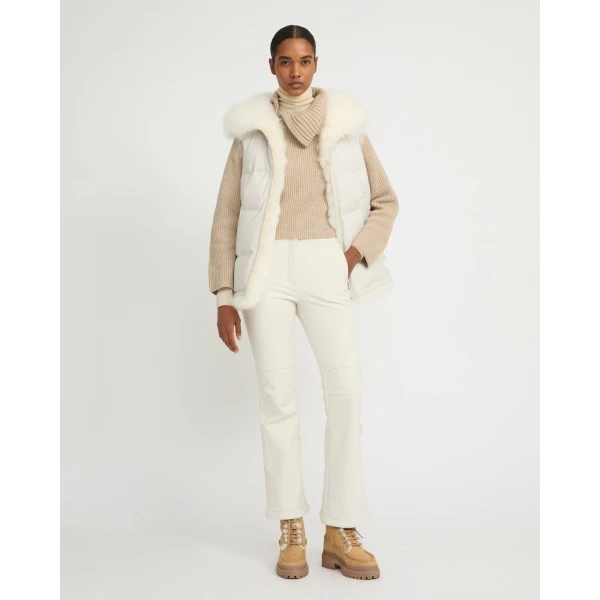 Woman wearing Yves Salomon shearling fur coat – luxury outerwear at Coveti