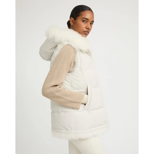Woman wearing Yves Salomon shearling fur coat – luxury outerwear at Coveti