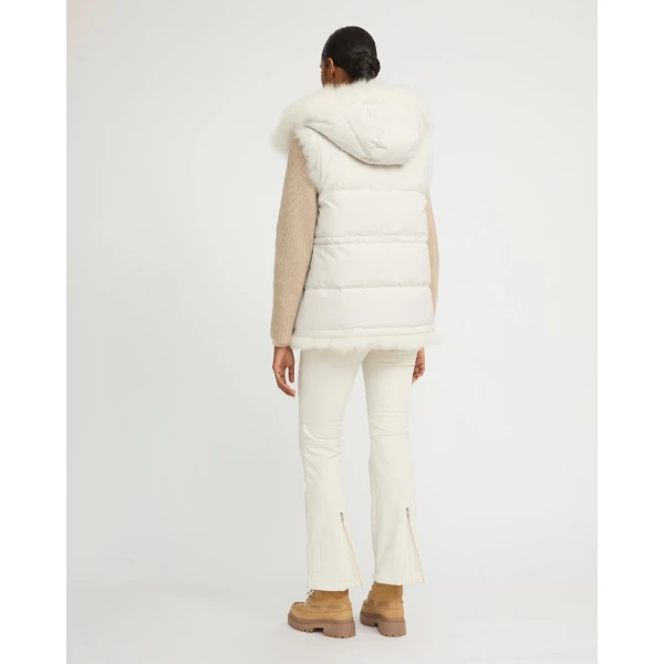 Woman wearing Yves Salomon shearling fur coat – luxury outerwear at Coveti