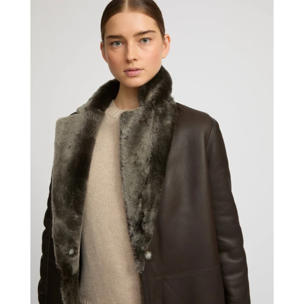 Woman wearing Yves Salomon shearling fur coat – luxury outerwear at Coveti