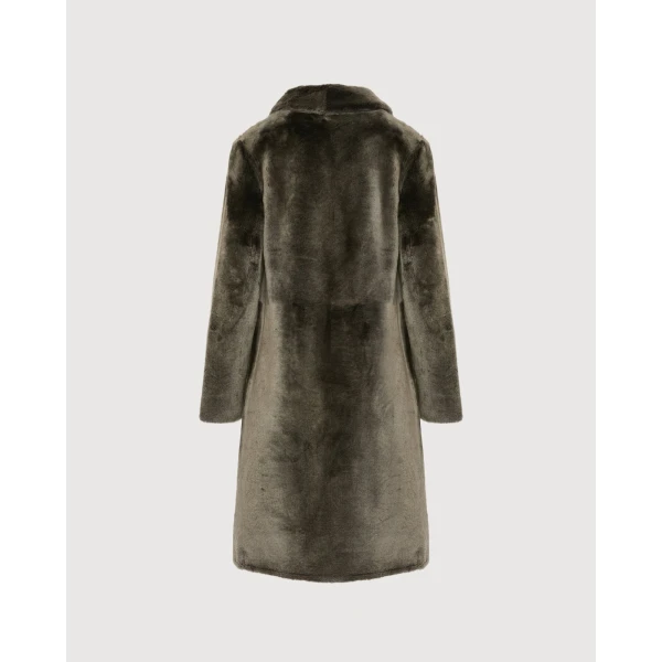 Woman wearing Yves Salomon shearling fur coat – luxury outerwear at Coveti