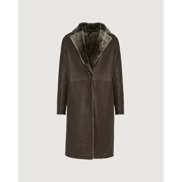Woman wearing Yves Salomon shearling fur coat – luxury outerwear at Coveti
