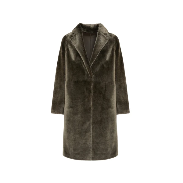 Woman wearing Yves Salomon shearling fur coat – luxury outerwear at Coveti