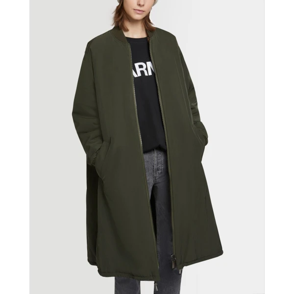 Woman wearing Yves Salomon shearling fur coat – luxury outerwear at Coveti