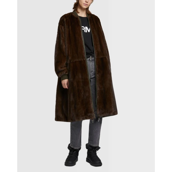 Woman wearing Yves Salomon shearling fur coat – luxury outerwear at Coveti