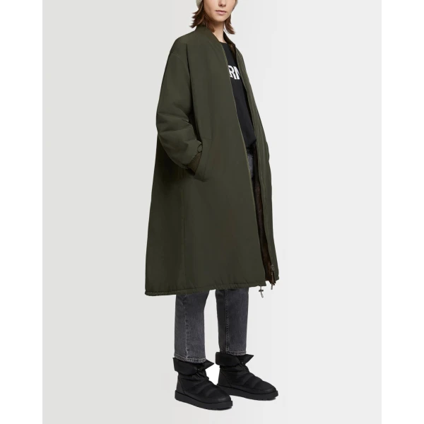 Woman wearing Yves Salomon shearling fur coat – luxury outerwear at Coveti