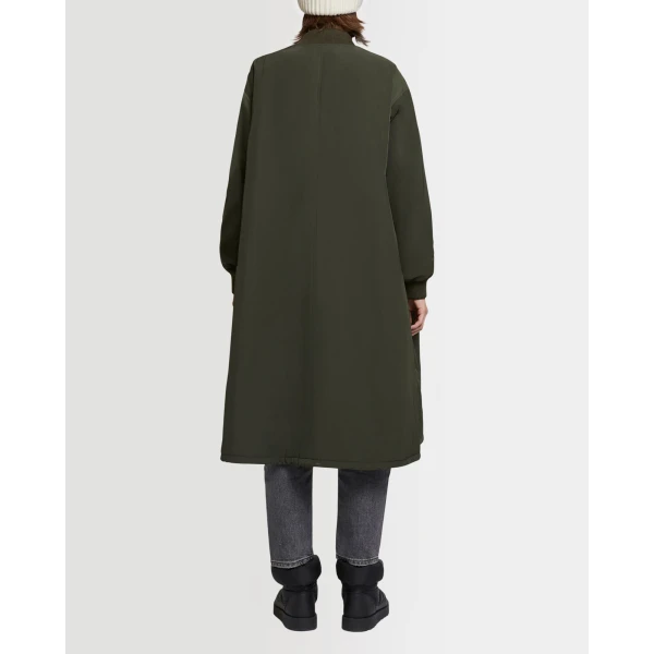 Woman wearing Yves Salomon shearling fur coat – luxury outerwear at Coveti