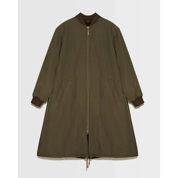 Woman wearing Yves Salomon shearling fur coat – luxury outerwear at Coveti