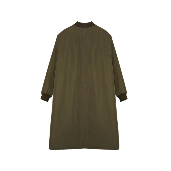 Woman wearing Yves Salomon shearling fur coat – luxury outerwear at Coveti