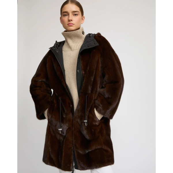 Woman wearing Yves Salomon shearling fur coat – luxury outerwear at Coveti