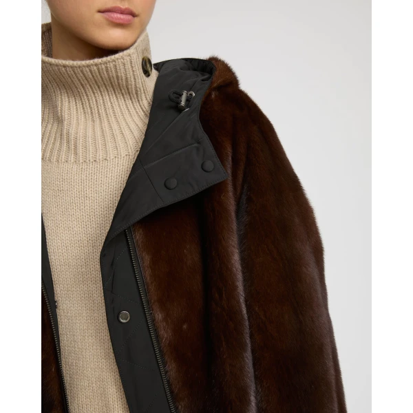 Woman wearing Yves Salomon shearling fur coat – luxury outerwear at Coveti