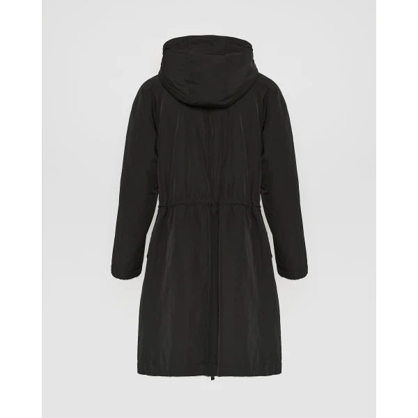Woman wearing Yves Salomon shearling fur coat – luxury outerwear at Coveti