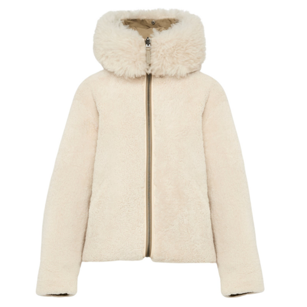 Woman wearing Yves Salomon shearling fur coat – luxury outerwear at Coveti