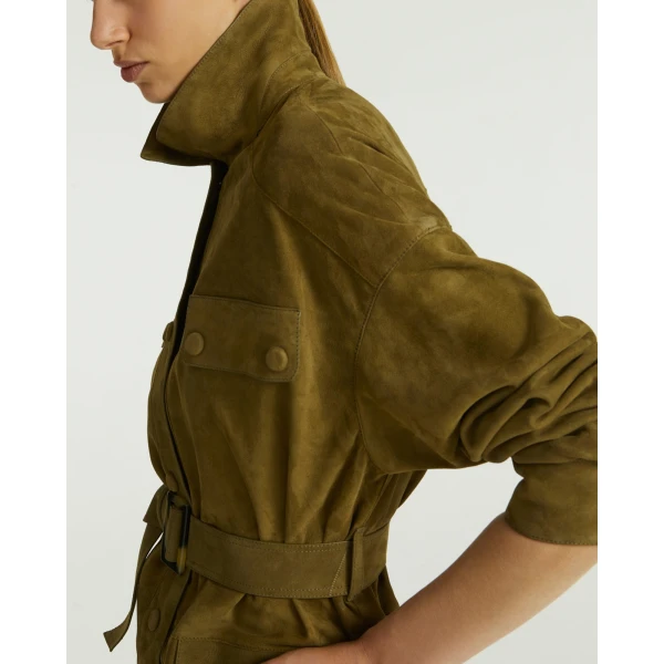 Woman wearing Yves Salomon shearling fur coat – luxury outerwear at Coveti
