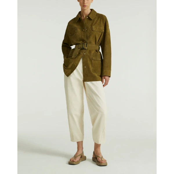 Woman wearing Yves Salomon shearling fur coat – luxury outerwear at Coveti